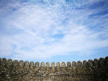 Low angle view of old ruin against sky