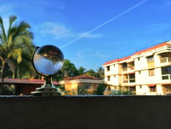 Close-up of glass building against sky