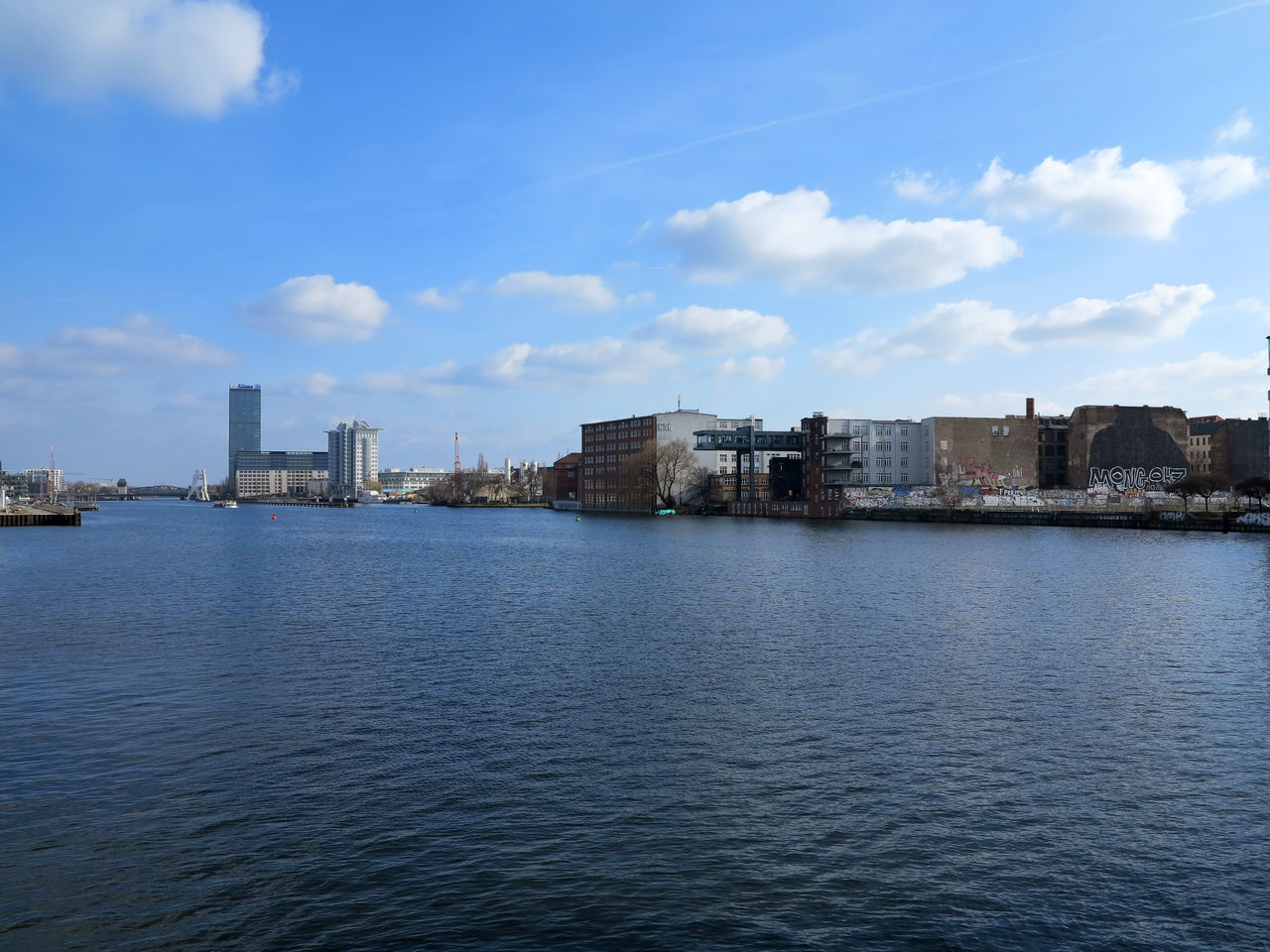 RIVER WITH CITYSCAPE IN BACKGROUND