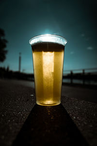 Close-up of beer glass on table