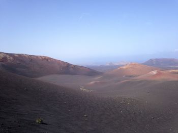 Scenic view of desert against clear sky