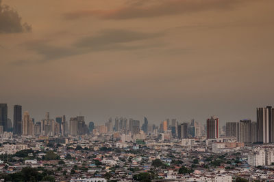 Cityscape against sky during sunset