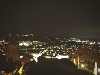 High angle view of illuminated city buildings at night