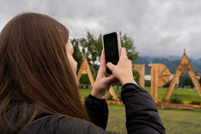 Young woman using mobile phone