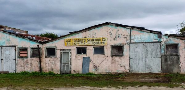 Abandoned building against sky