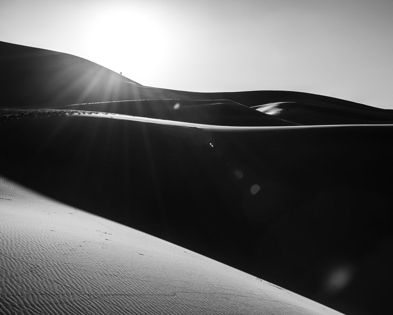 CLOSE-UP OF CAR AGAINST SKY