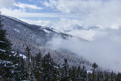 Scenic view of mountains against sky during winter