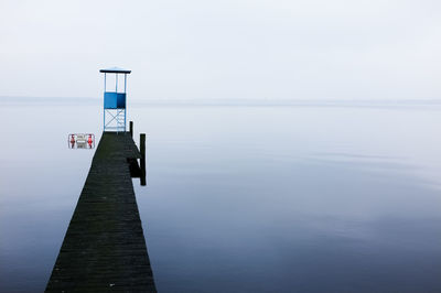 Pier over sea against sky