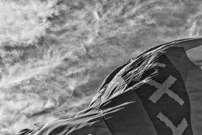 Low angle view of flag against sky