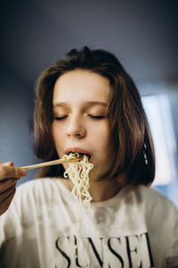 Girl eating food at home