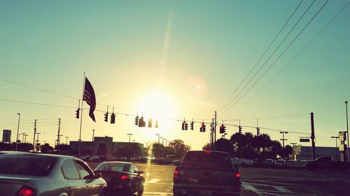 Traffic on road during sunset