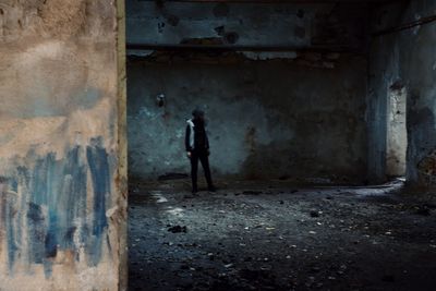 Full length of man walking in corridor