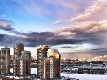 Modern buildings in city against sky