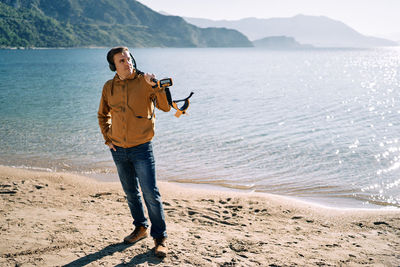 Full length of man standing at beach