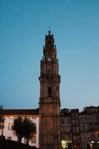 Low angle view of clock tower against sky in city