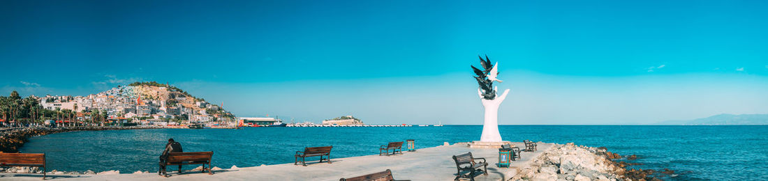 Scenic view of sea against clear blue sky