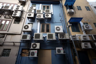 Low angle view of air conditioners on buildings