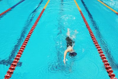 High angle view of man swimming in pool