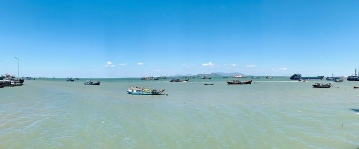 Scenic view of sea against blue sky