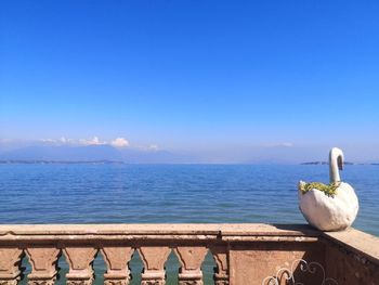 Scenic view of lake against blue sky