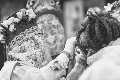 Ancient carnival of sauris. traditional wooden masks. black and white. italy