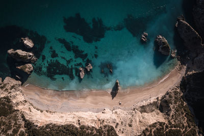 High angle view of man swimming in sea