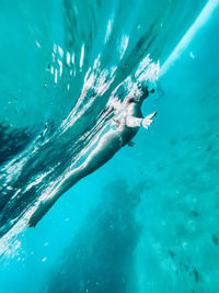 High angle view of man swimming in sea