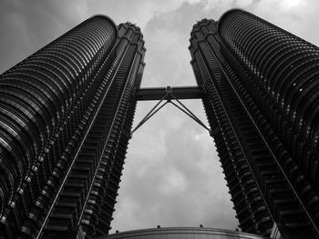 Low angle view of petronas towers against sky in city