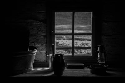 Containers on table against window at home