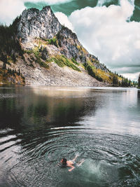 High angle view of man swimming in lake