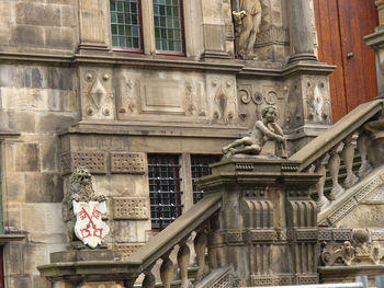 Low angle view of statue against building