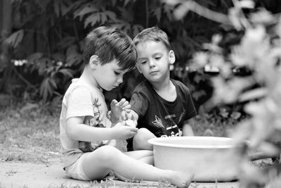 High angle view of friends sitting outdoors