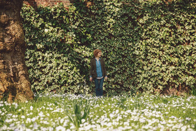 Young woman standing in park