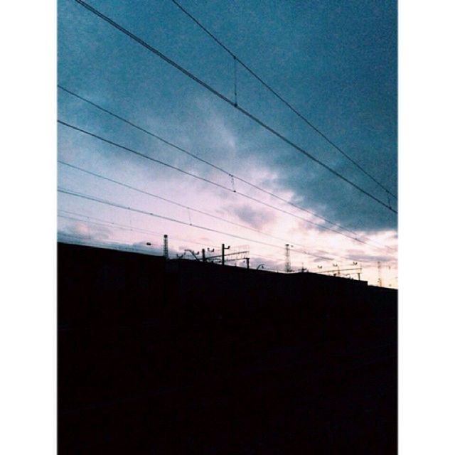 power line, built structure, architecture, sky, low angle view, building exterior, cable, electricity pylon, silhouette, power supply, connection, electricity, transfer print, cloud - sky, fuel and power generation, auto post production filter, cloud, dusk, power cable, building