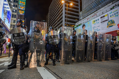 People standing on street in city