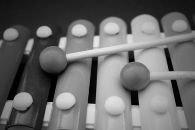 Close-up of toy xylophone against black background