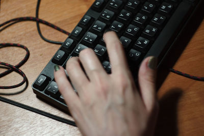 High angle view of person using laptop on table