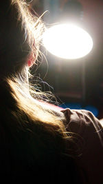 Close-up portrait of woman with illuminated light