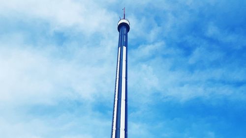 Low angle view of communications tower against sky