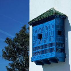 Low angle view of building against blue sky