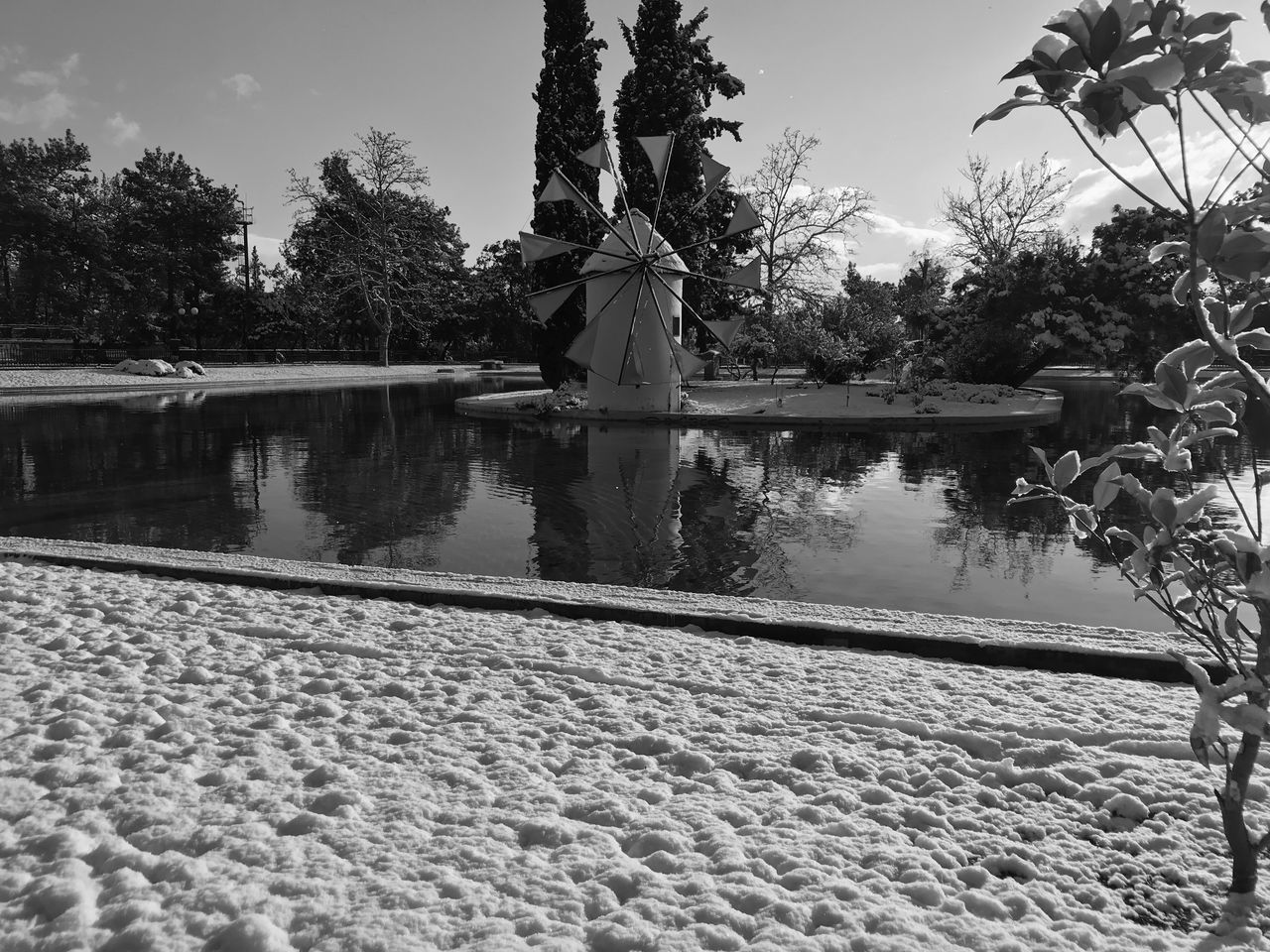 GAZEBO BY LAKE AGAINST SKY