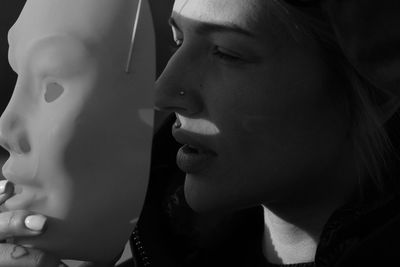 Close-up portrait of young woman looking away