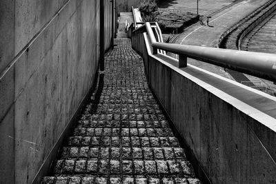 High angle view of footpath by wall