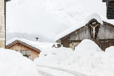 Snow magic. walk in the ancient village of sappada. friuli