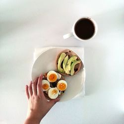 Cropped image of hand holding coffee