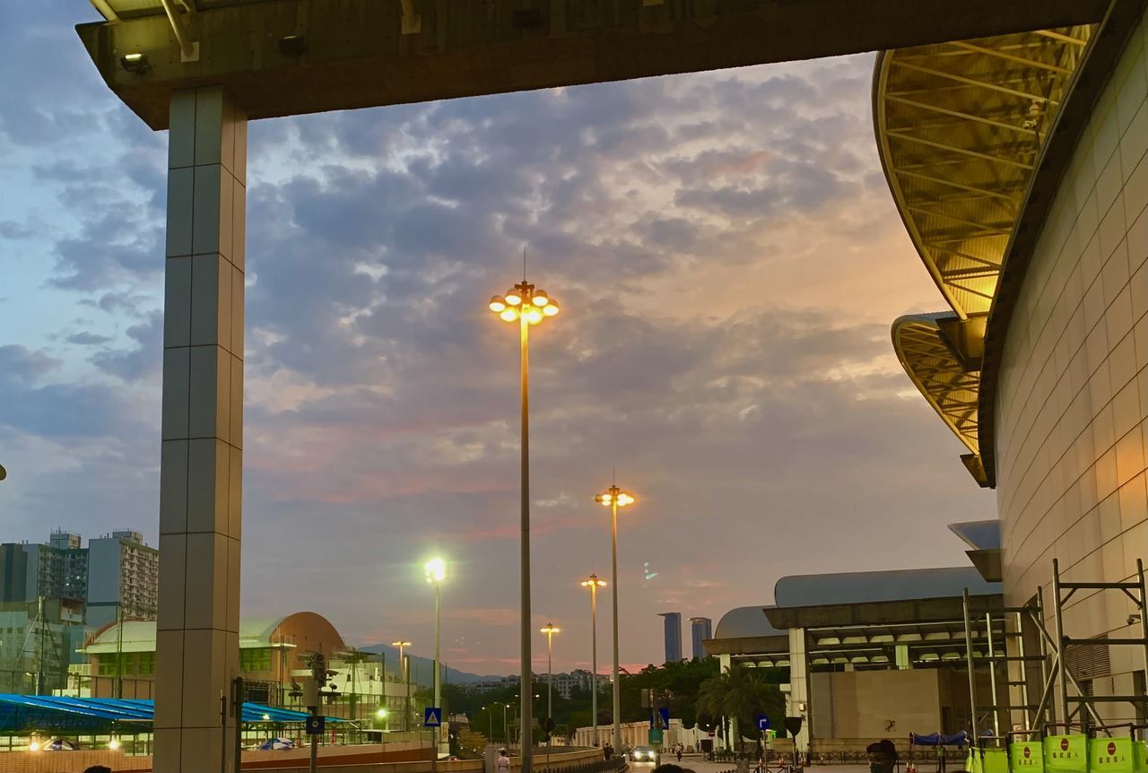 LOW ANGLE VIEW OF BUILDINGS AT SUNSET