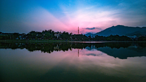 Scenic view of lake against sky during sunset
