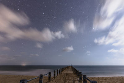 Scenic view of sea against sky at night