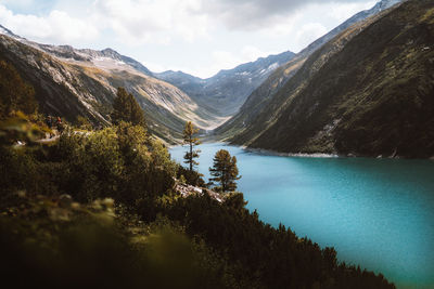 Scenic view of lake and mountains against sky