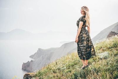 Young woman standing on mountain